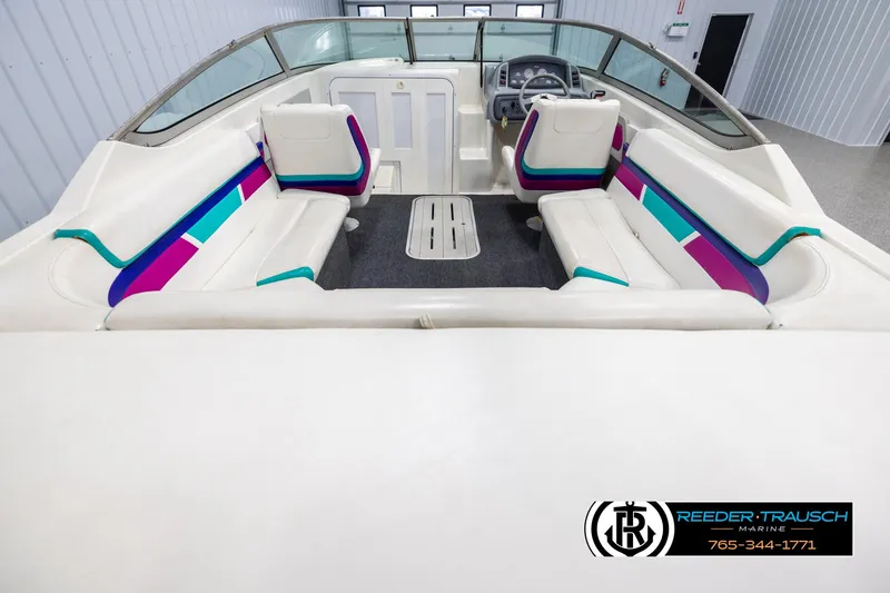 Slide: The Image of 1996 Thunderbird Falcon 2270 CD boat interior with colorful seating and steering wheel. - 12
