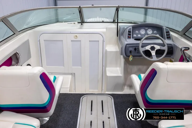 Slide: The Image of 1996 Thunderbird Falcon 2270 CD boat interior with steering wheel and colorful seating. - 13