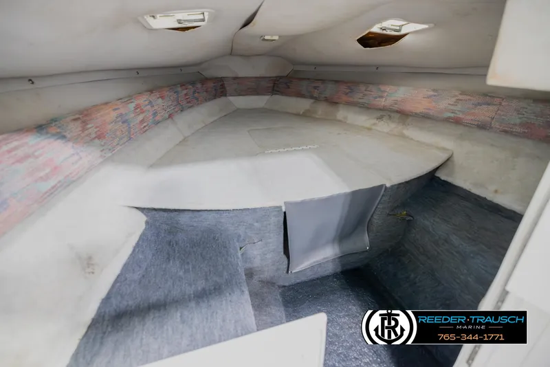 Slide: The Image of 1996 Thunderbird Falcon 2270 CD boat interior cabin with carpeted flooring. - 14