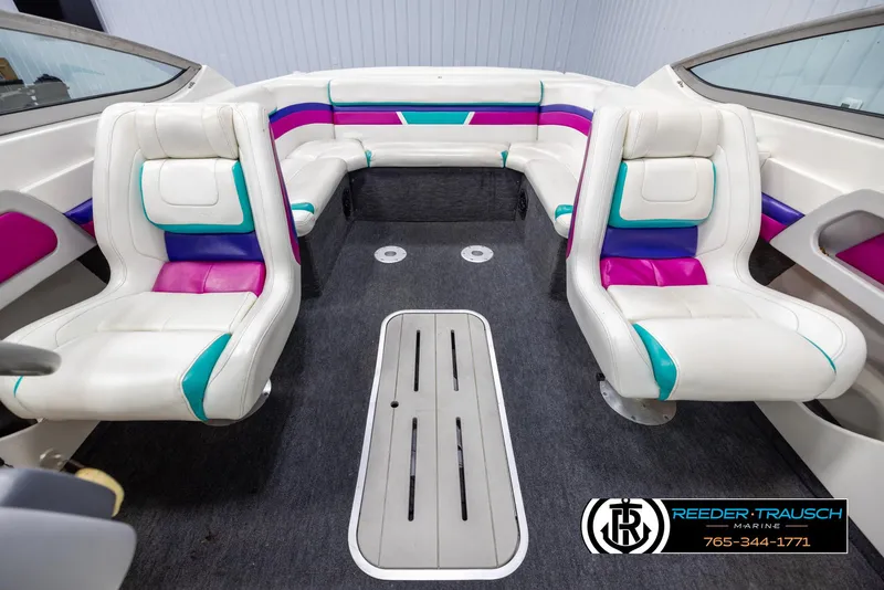 Slide: The Image of Interior of a 1996 Thunderbird Falcon 2270 CD boat with colorful seating. - 16