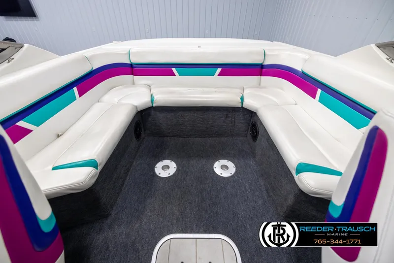 Slide: The Image of 1996 Thunderbird Falcon 2270 CD boat interior with colorful seating and carpeted floor. - 17