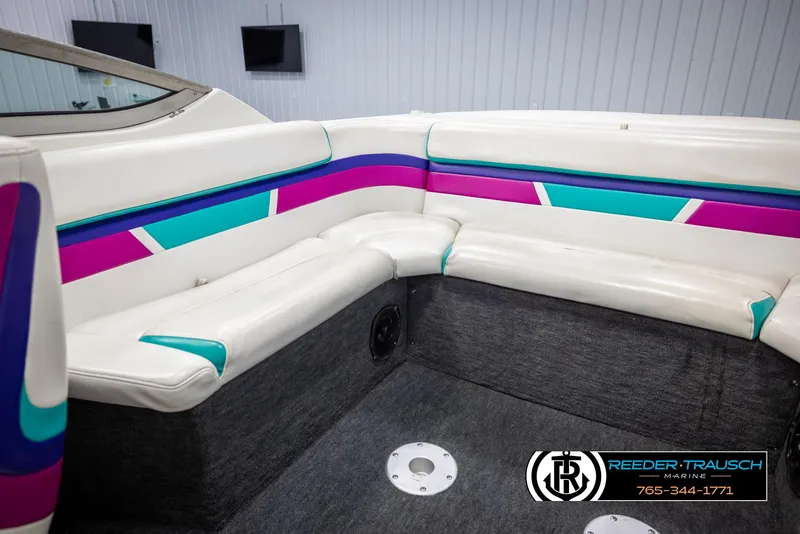 Slide: The Image of 1996 Thunderbird Falcon 2270 CD boat interior with colorful seating and modern design. - 18