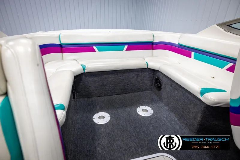 Slide: The Image of 1996 Thunderbird Falcon 2270 CD boat interior with colorful seating and carpeted floor. - 20
