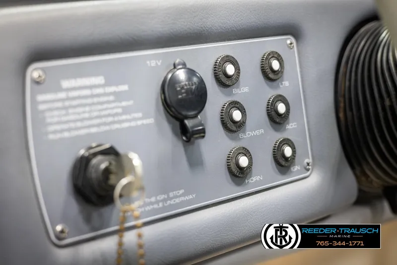 Slide: The Image of Control panel of a 1996 Thunderbird Falcon 2270 CD boat with labeled switches. - 24