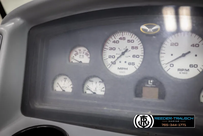 Slide: The Image of Dashboard of a 1996 Thunderbird Falcon 2270 CD with speedometer and gauges. - 26