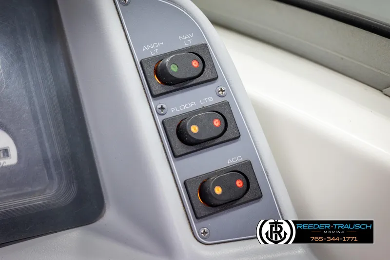 Slide: The Image of Control panel of a 1996 Thunderbird Falcon 2270 CD boat with labeled switches. - 30