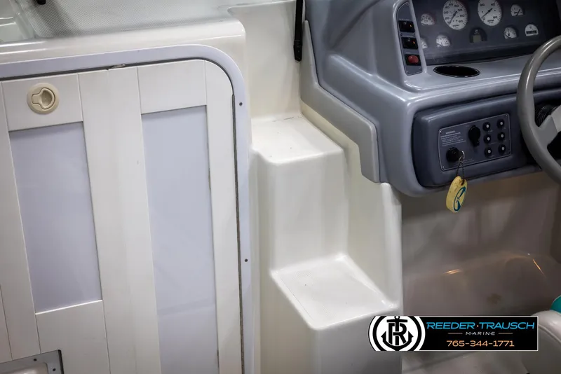 Slide: The Image of 1996 Thunderbird Falcon 2270 CD boat interior with control panel and cabin door. - 37