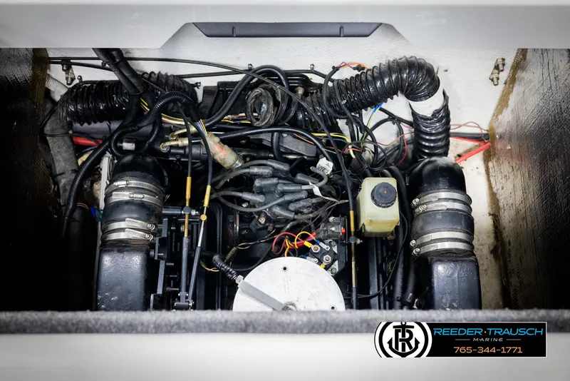 Slide: The Image of Engine compartment of a 1996 Thunderbird Falcon 2270 CD boat, featuring various components and wiring. - 38