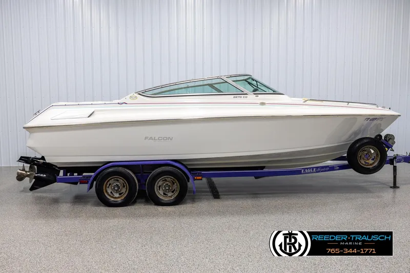 Slide: The Image of 1996 Thunderbird Falcon 2270 CD boat on trailer in showroom. - 4