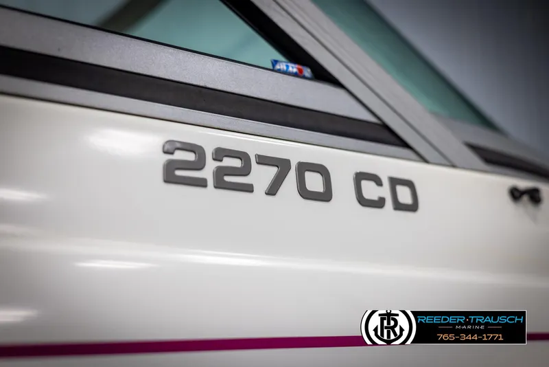 Slide: The Image of 1996 Thunderbird Falcon 2270 CD boat, close-up of model name on white exterior. - 43
