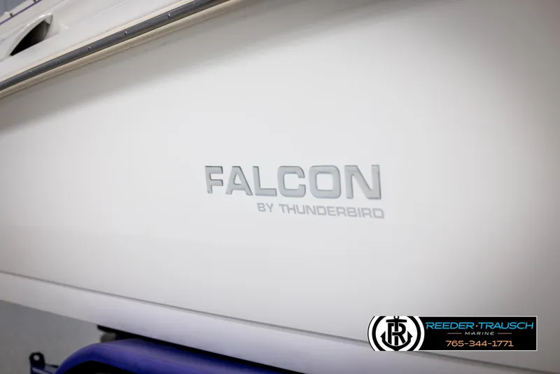 Slide: The Image of 1996 Thunderbird Falcon 2270 CD boat side view with logo and branding. - 44