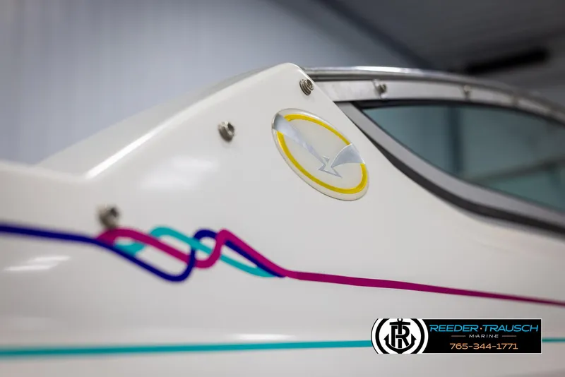 Slide: The Image of 1996 Thunderbird Falcon 2270 CD boat with colorful design and logo detail. - 45