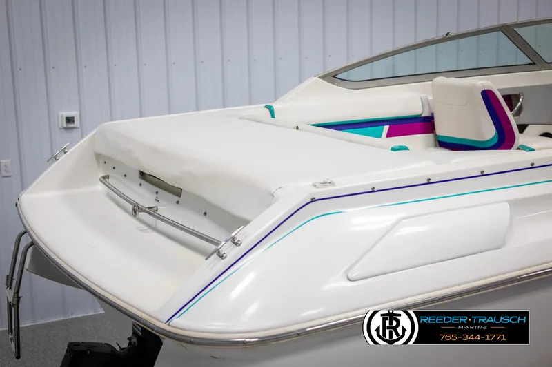 Slide: The Image of 1996 Thunderbird Falcon 2270 CD boat with colorful interior accents, displayed indoors. - 46