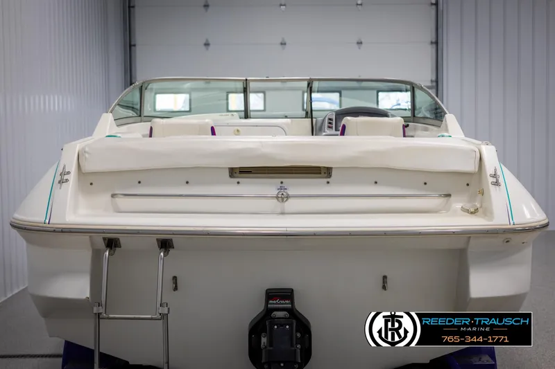 Slide: The Image of 1996 Thunderbird Falcon 2270 CD boat, rear view in a garage setting. - 6