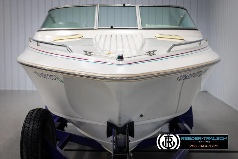 Slide: The Image of 1996 Thunderbird Falcon 2270 CD boat on trailer, front view in showroom. - 7