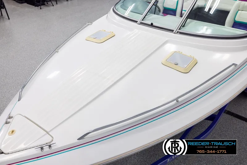 Slide: The Image of 1996 Thunderbird Falcon 2270 CD boat, white deck, sleek design, indoor showroom display. - 9