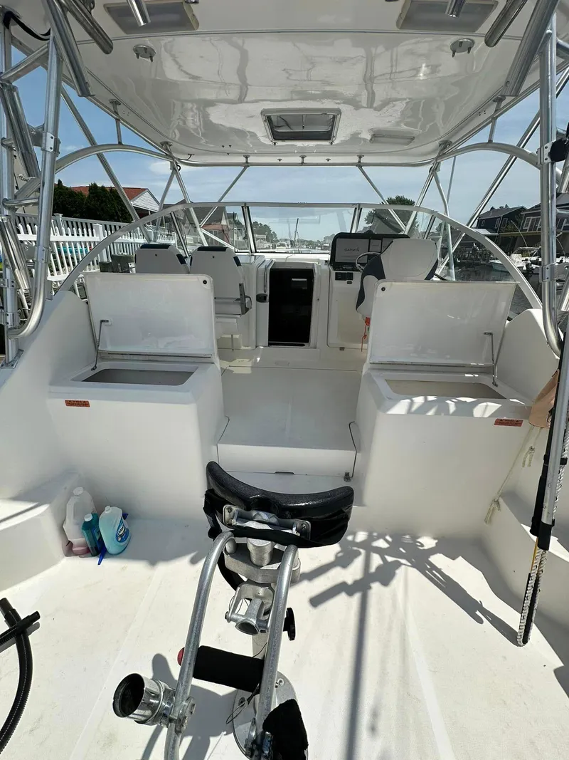 Slide: The Image of 2006 Luhrs 28 Open boat interior with seating and steering console. - 3
