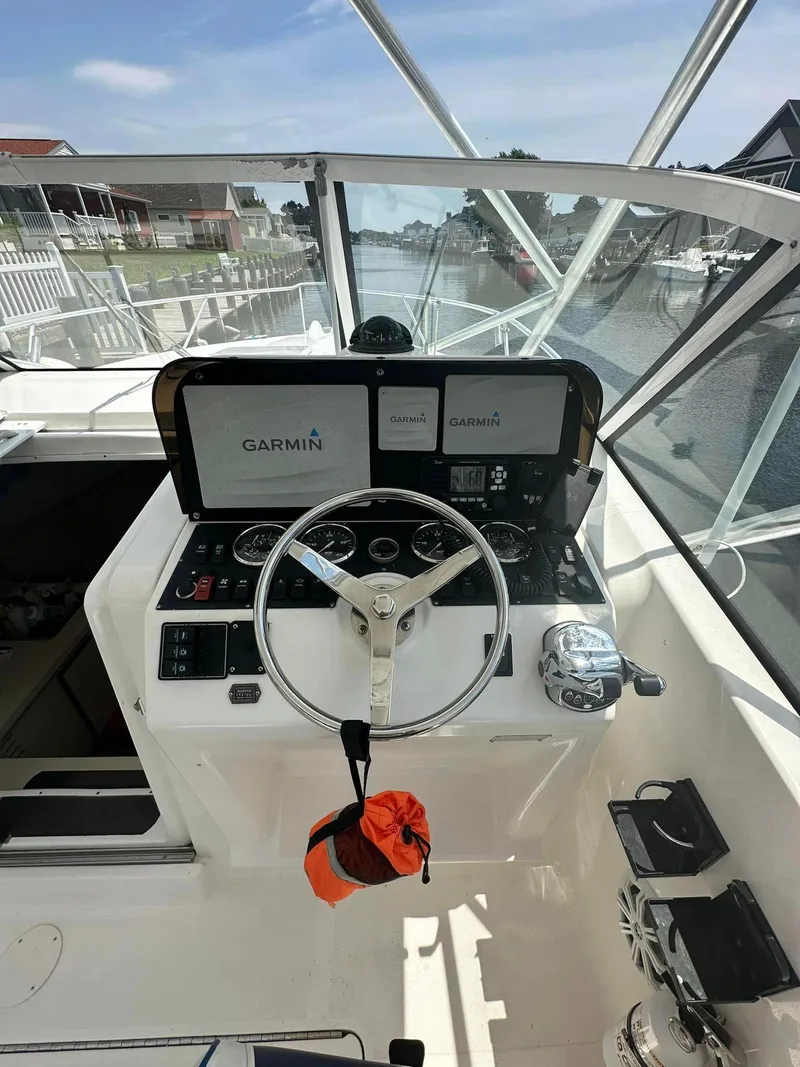 Slide: The Image of 2006 Luhrs 28 Open boat helm with Garmin navigation system. - 5