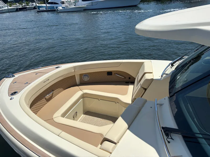 Slide: The Image of 2025 Chris-Craft Calypso 32 boat interior with luxurious seating and elegant design. - 14