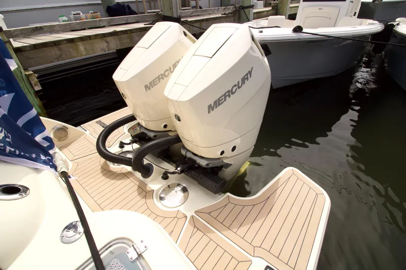 Slide: The Image of 2025 Chris-Craft Calypso 32 with dual Mercury outboard engines at dock. - 18