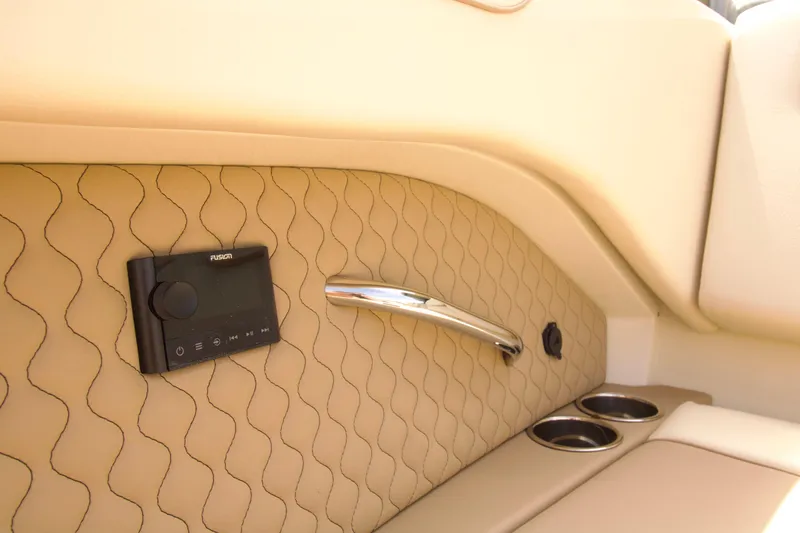 Slide: The Image of Luxurious interior of 2025 Chris-Craft Calypso 32 with Fusion audio system and cup holders. - 20
