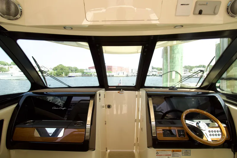Slide: The Image of Interior view of 2025 Chris-Craft Calypso 32 boat cockpit with steering wheel. - 22