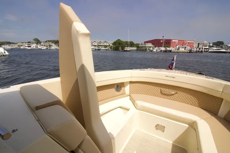 Slide: The Image of 2025 Chris-Craft Calypso 32 boat interior with luxurious seating and waterfront view. - 26