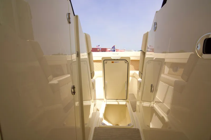 Slide: The Image of 2025 Chris-Craft Calypso 32 interior with sleek design and storage compartments. - 30