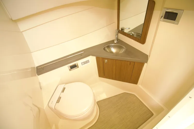 Slide: The Image of 2025 Chris-Craft Calypso 32 boat bathroom with modern sink and toilet. - 31
