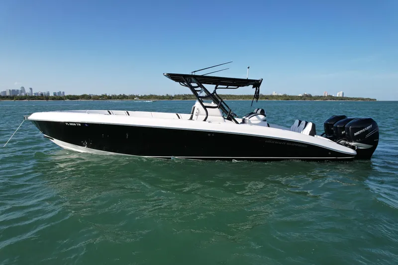 The Image of 2009 Midnight Express 34' Open boat on calm water, side view. - 0