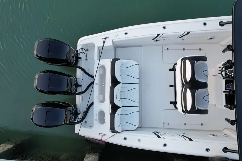 Slide: The Image of 2009 Midnight Express 34' Open boat with triple outboard engines, aerial view. - 11