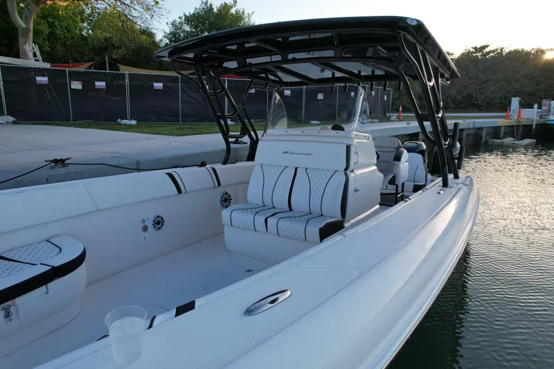 Slide: The Image of 2009 Midnight Express 34' Open boat with sleek design docked by the water. - 14