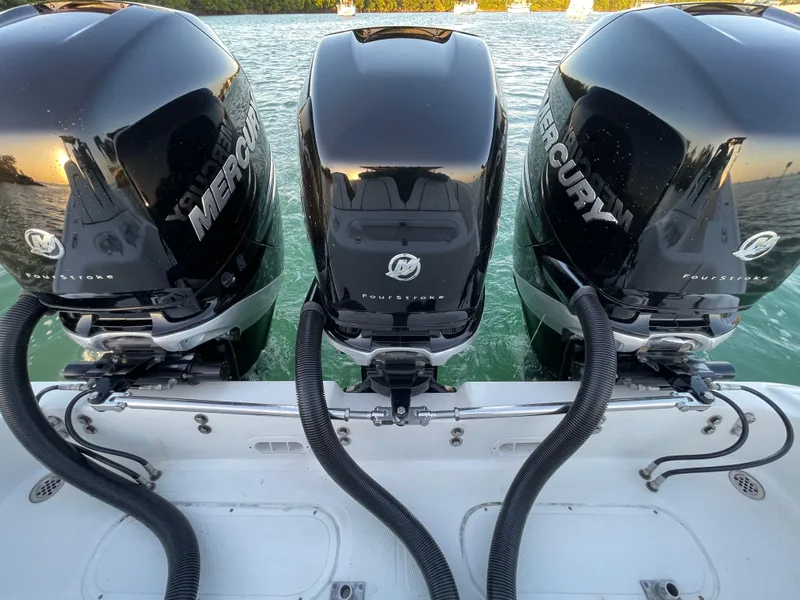 Slide: The Image of Triple Mercury outboard engines on a 2009 Midnight Express 34' Open boat. - 15