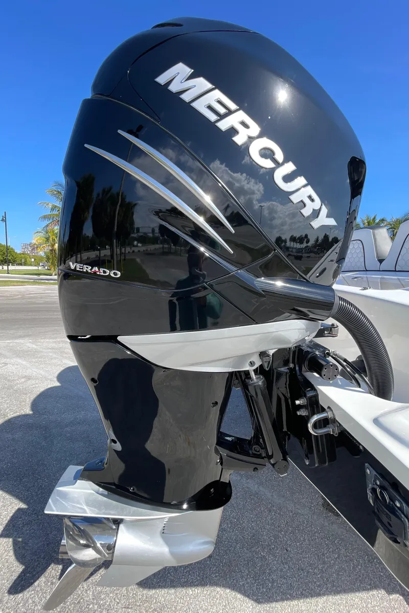 Slide: The Image of 2009 Midnight Express 34' Open with Mercury Verado outboard motor, parked outdoors. - 16