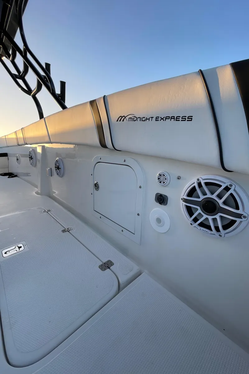 Slide: The Image of 2009 Midnight Express 34' Open boat interior with speakers and storage compartments. - 19