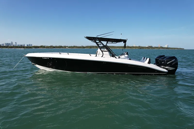 Slide: The Image of 2009 Midnight Express 34' Open boat on calm water, side view. - 2