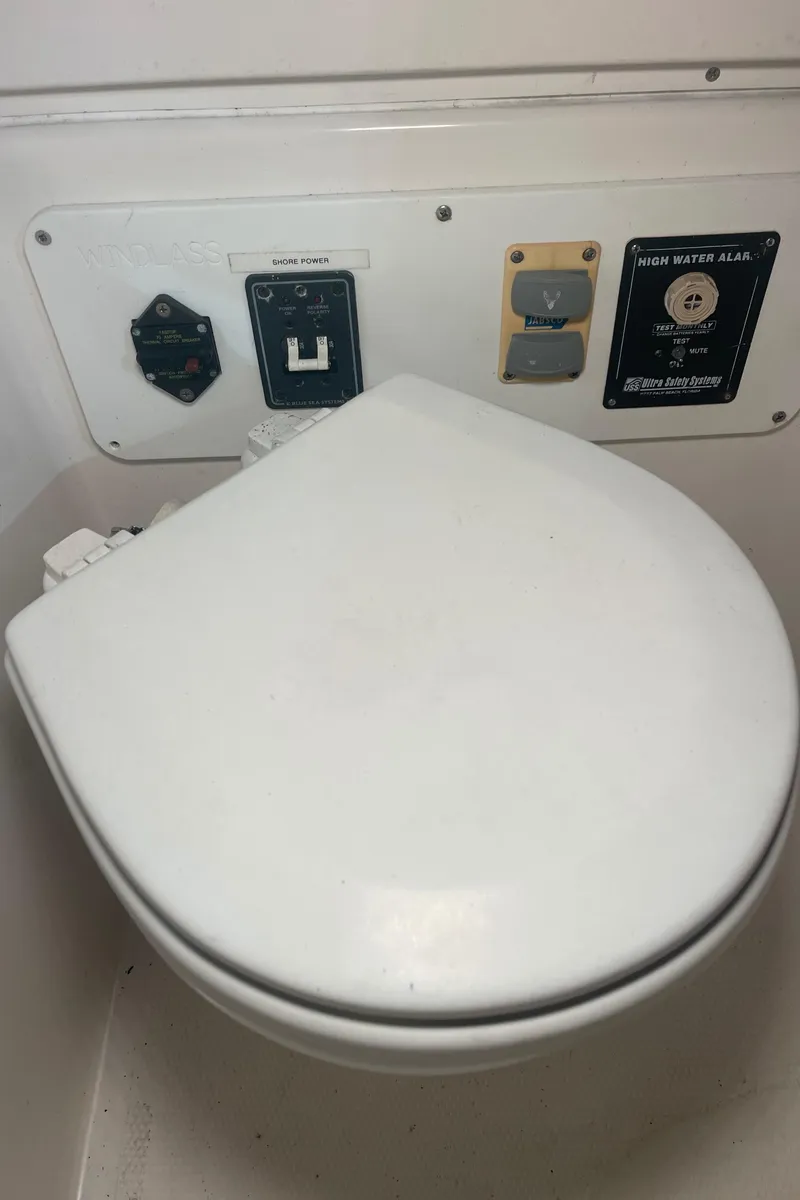Slide: The Image of 2009 Midnight Express 34' Open boat toilet with control panel. - 24