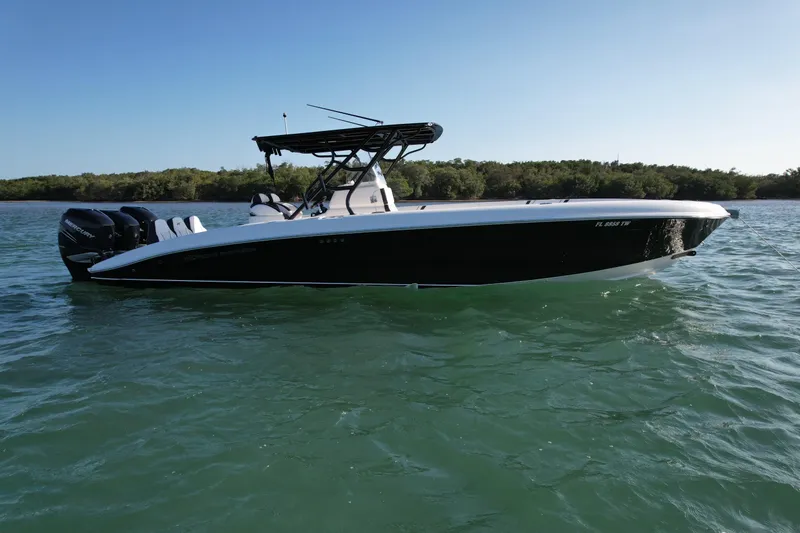 Slide: The Image of 2009 Midnight Express 34' Open boat on calm water, side view. - 3