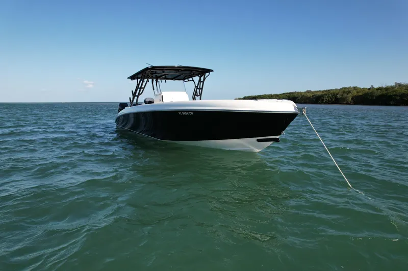 Slide: The Image of 2009 Midnight Express 34' Open boat anchored on calm water. - 4