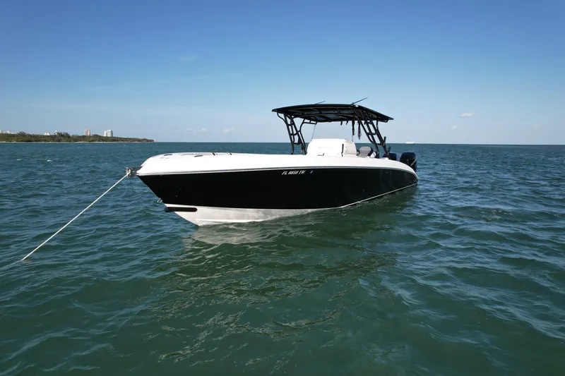 Slide: The Image of 2009 Midnight Express 34' Open boat anchored on calm sea. - 5