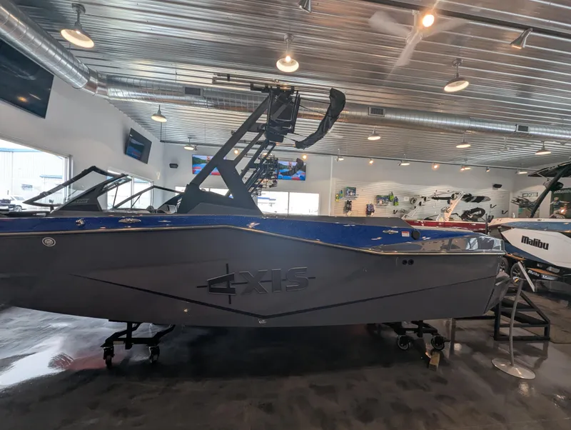 The Image of 2025 Axis T220 boat displayed in a showroom with modern interior design. - 1