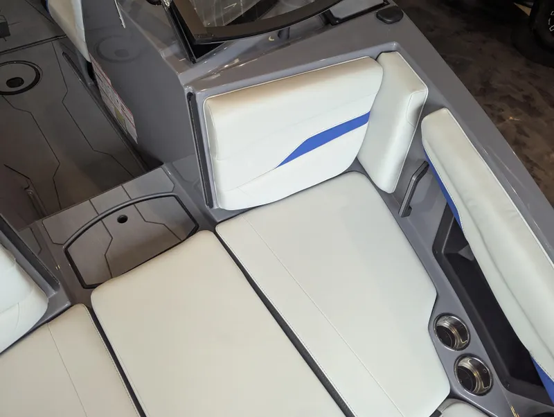 Slide: The Image of 2025 Axis T220 boat interior with white and blue cushioned seating. - 15