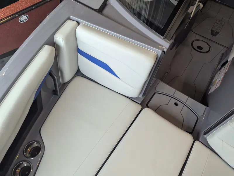 Slide: The Image of 2025 Axis T220 boat interior with white and blue seating, modern design. - 16