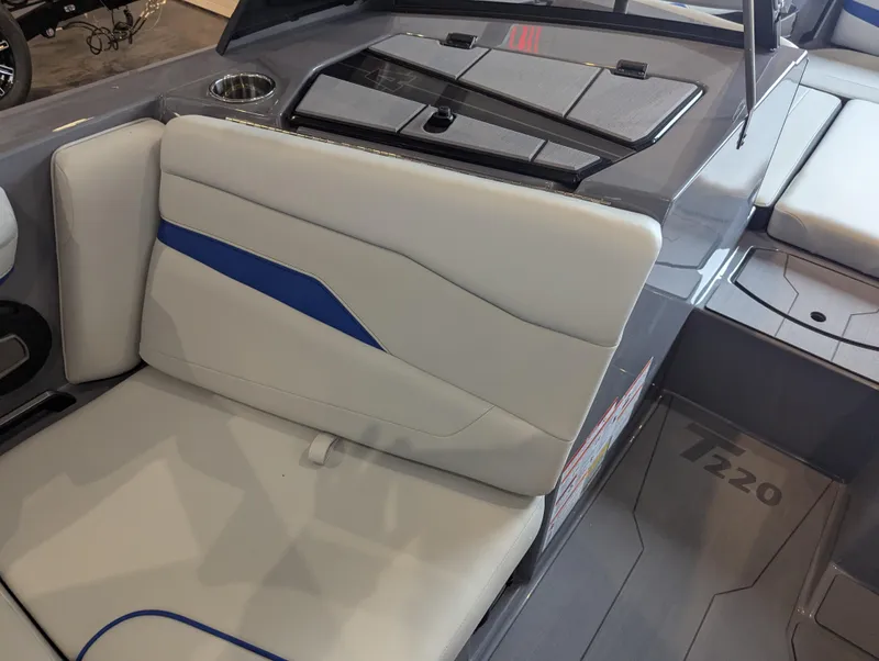 Slide: The Image of Interior of 2025 Axis T220 boat with white and blue seating. - 9