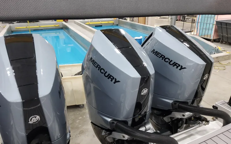 Slide: The Image of Three Mercury outboard engines on a 2025 Formula 400 Super Sport Crossover boat. - 11