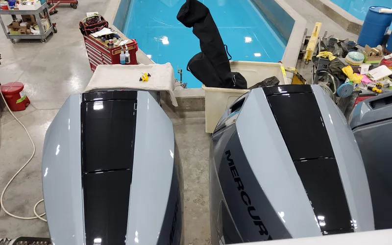Slide: The Image of 2025 Formula 400 Super Sport Crossover engines near a pool in a workshop setting. - 12