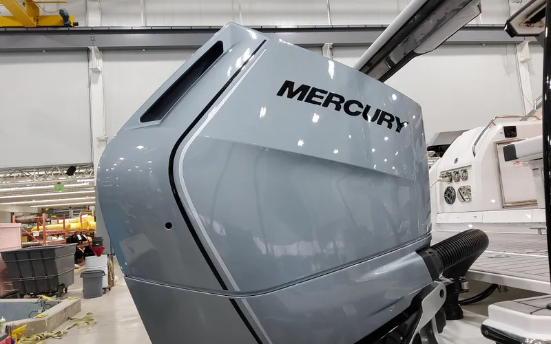 Slide: The Image of 2025 Formula 400 Super Sport Crossover with Mercury engine in a workshop. - 14