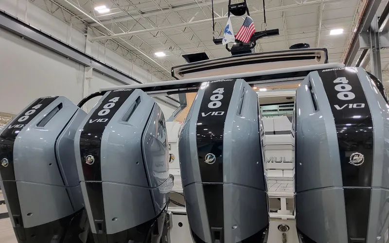 Slide: The Image of 2025 Formula 400 Super Sport Crossover with four powerful V10 engines in a showroom. - 15