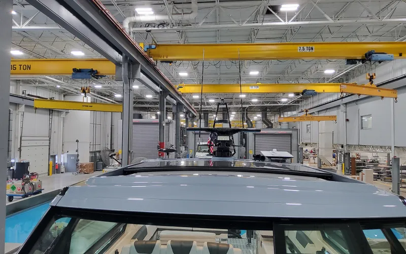 Slide: The Image of 2025 Formula 400 Super Sport Crossover in a modern manufacturing facility. - 23