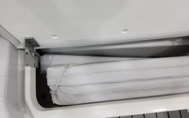 Slide: The Image of 2025 Formula 400 Super Sport Crossover storage compartment with white cushion. - 34